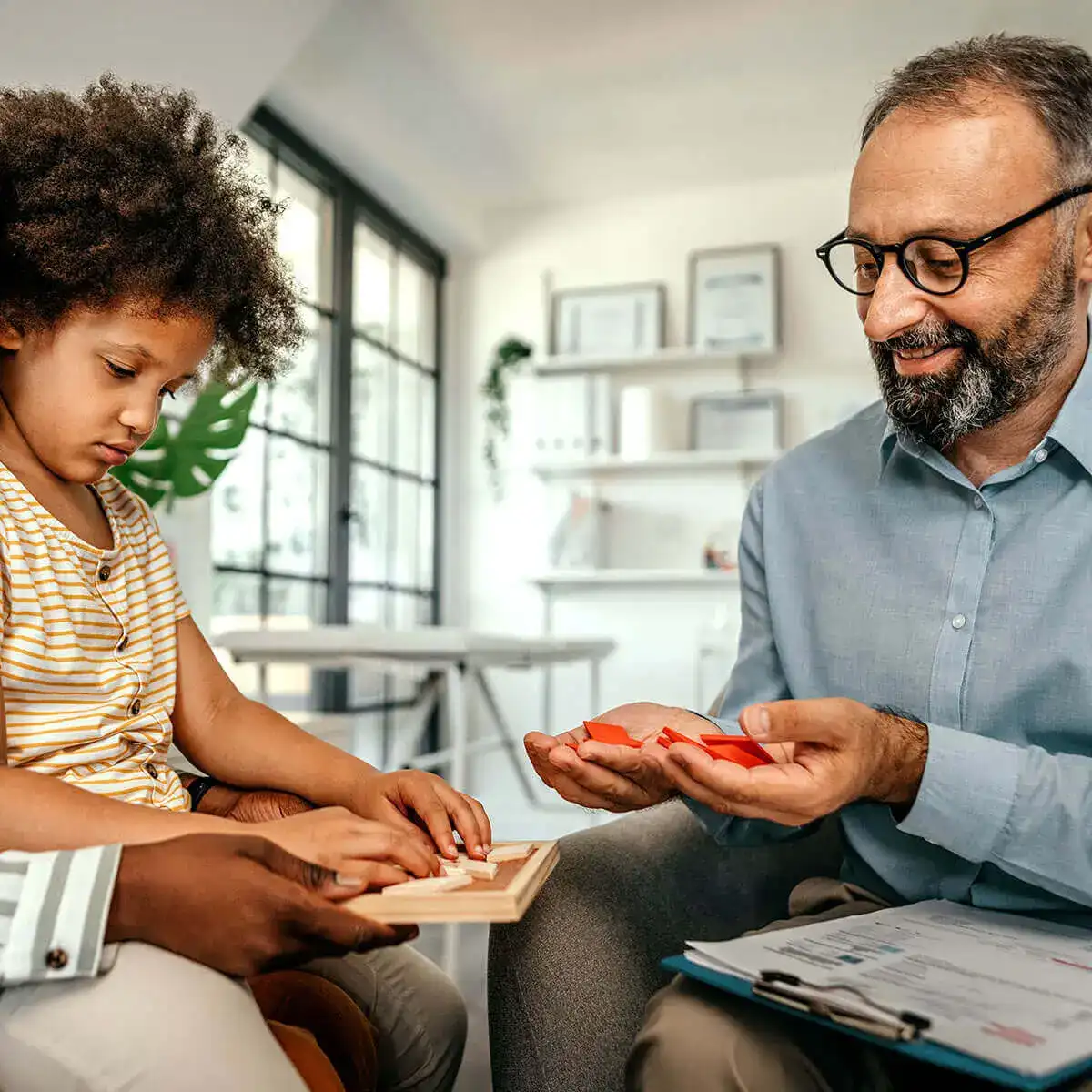 Psychologist meeting with child patient