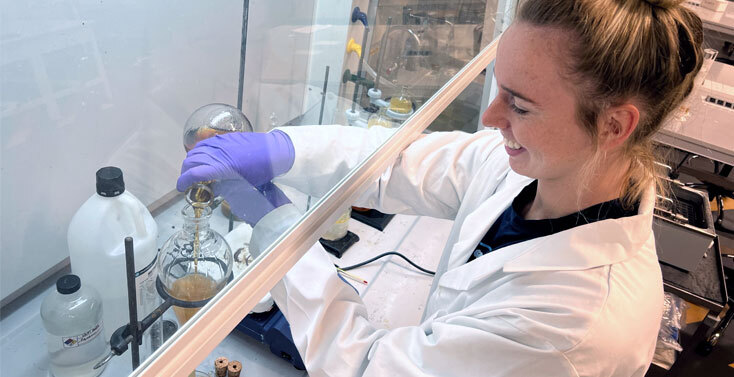 Biology degree hero image of student working in the lab