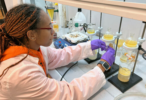 Student working in biology lab.