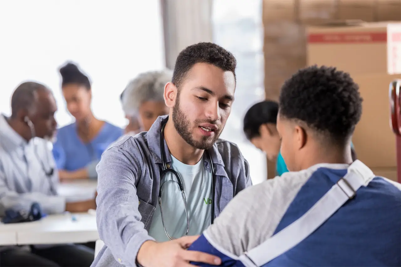 doctor looking at kids arm