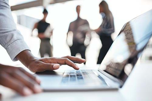 person typing on a laptop