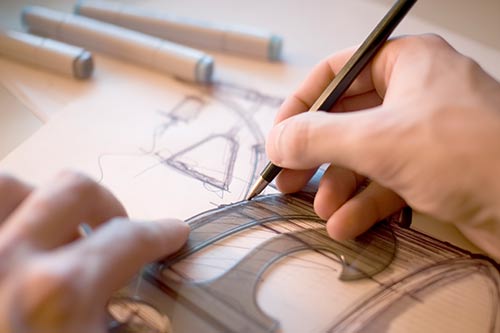 person creating a technical drawing