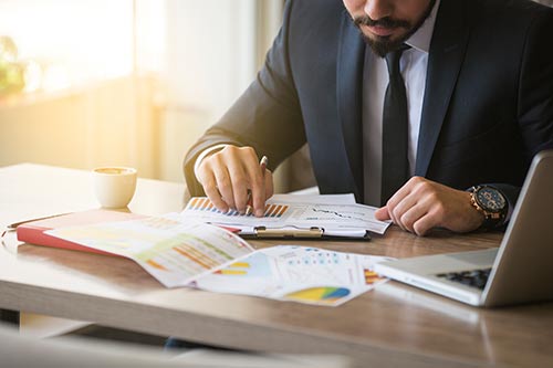 a man looking over financial data